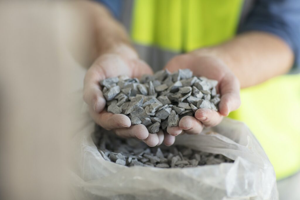 Worker holding gravel
